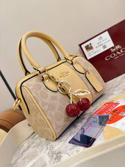 Coach Mini Rowan Bag in Signature Canvas with Cherry Charm