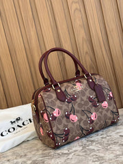 Coach Rowan Satchel in Signature Canvas with a cherry print
