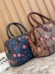 Coach Rowan Satchel in Signature Canvas with a cherry print